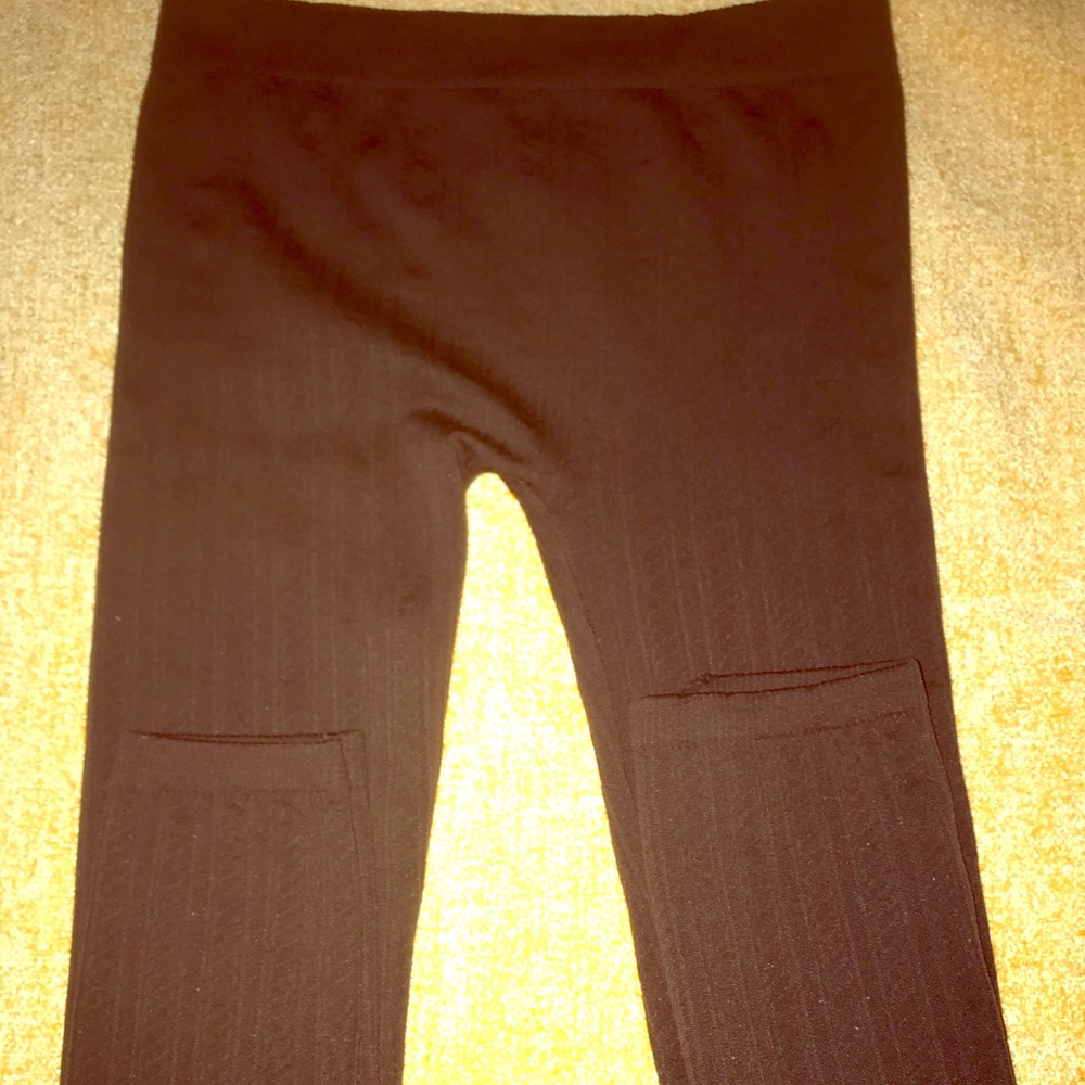 Brown cord striped stretch pants.
